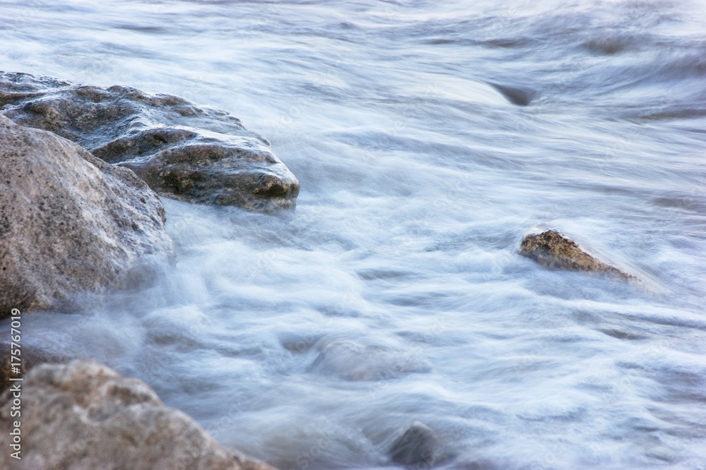 surf on rocky shore