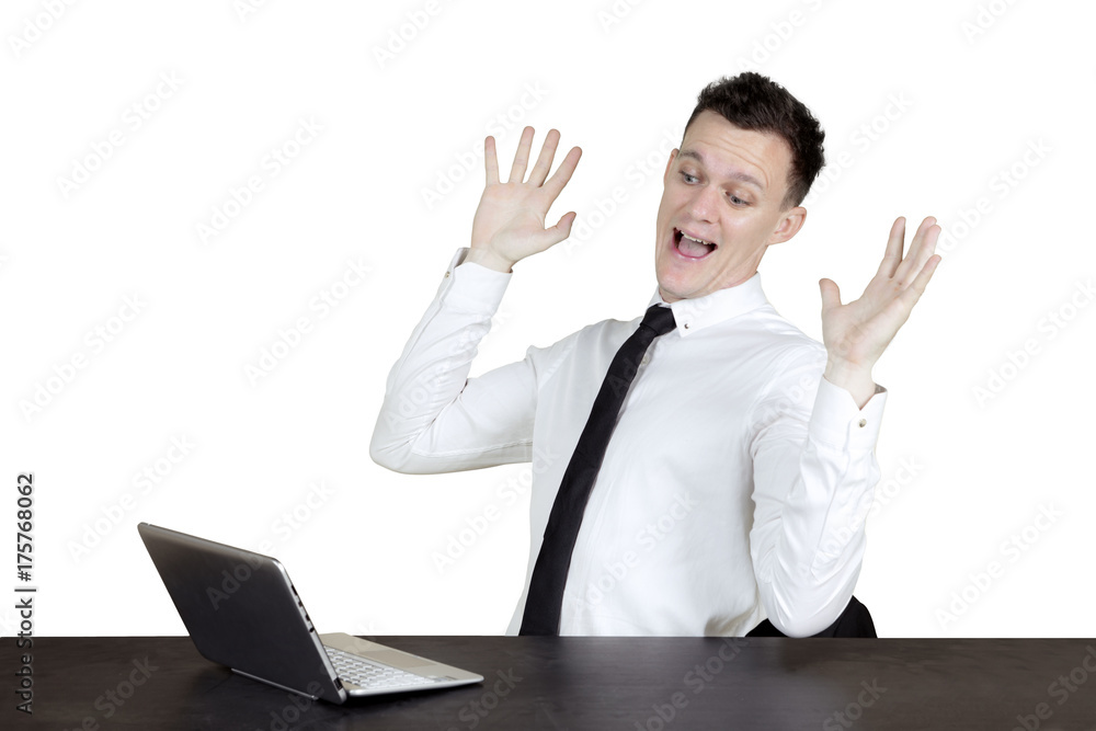 Shocked Caucasian businessperson with laptop Shocked Caucasian businessperson with laptop