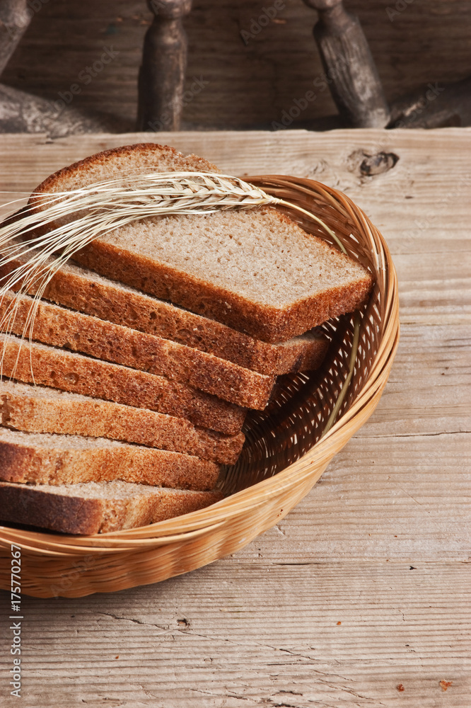 slices of rye bread and ears of corn in basket