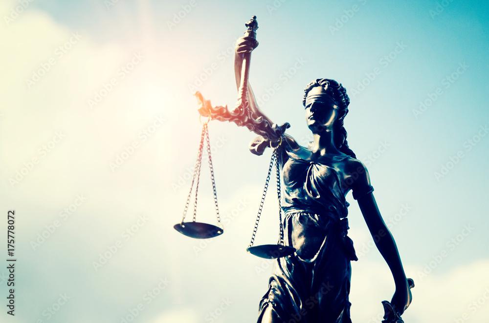 Lady justice, themis, statue of justice on sky background Lady justice, themis, statue of justice on sky background