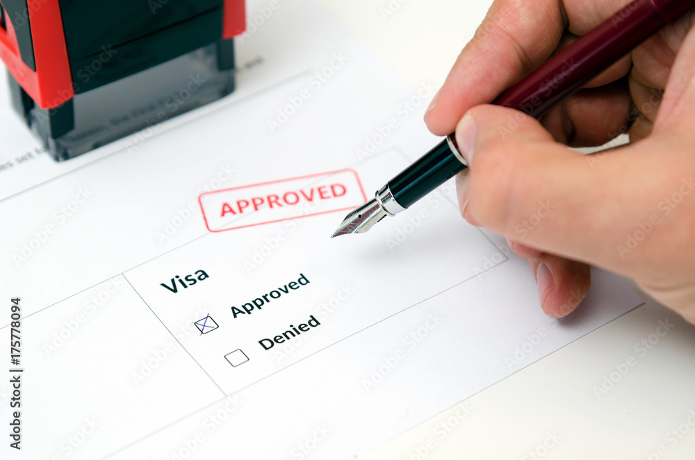 Visa and approved stamp on a document form Visa and approved stamp on a document form