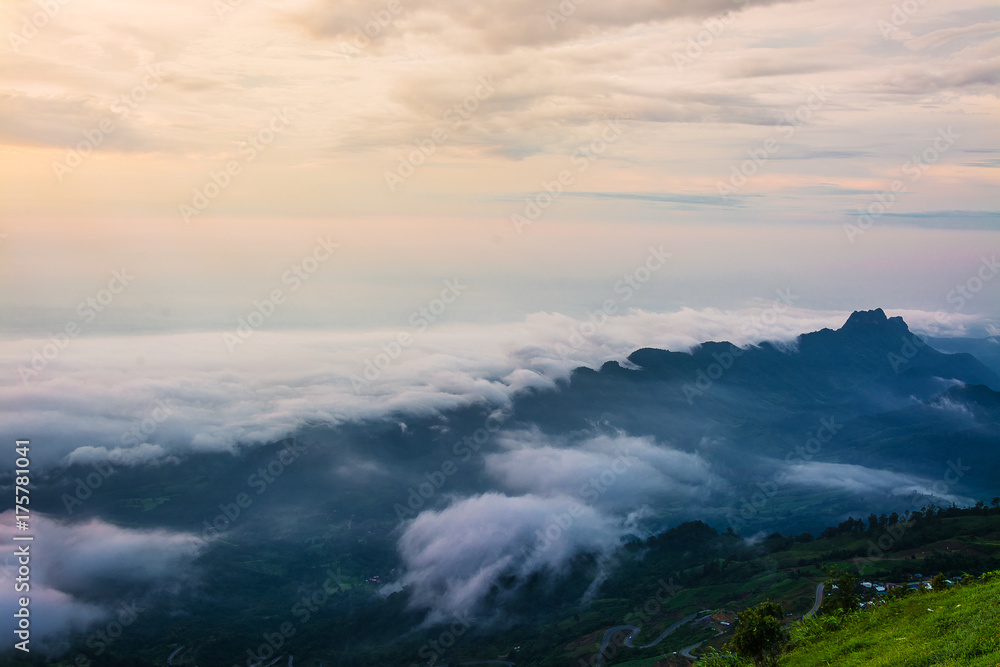 Naklejka premium Morning Mist with Mountain ,Sunrise and sea of mis