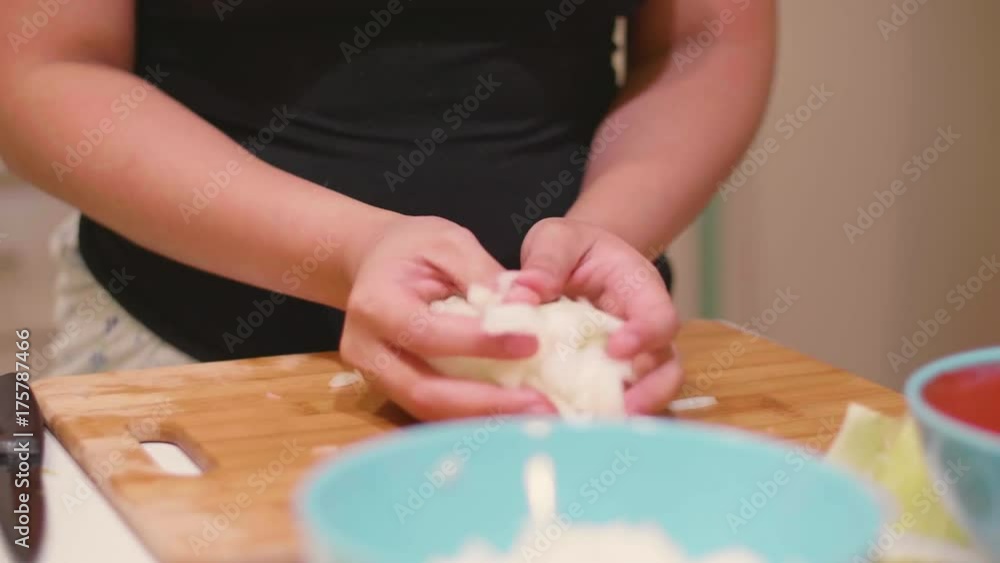 Chopping onions and putting them in a bowl Chopping onions and putting them in a bowl