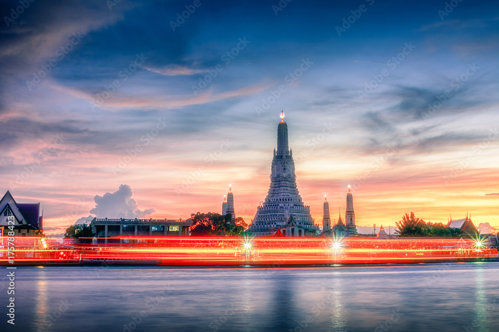 The beauty of the temple, Thailand at sunset. Light caused by the movement of the ship. Wat Arun, a beautiful temple of Bangkok, Thailand.