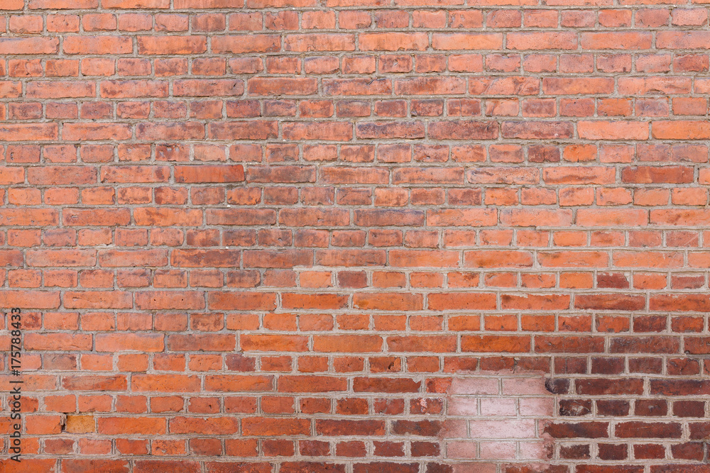 Fototapeta premium Old worn urban brick wall texture background