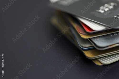 Stack of multicolored credit cards close-up