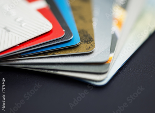 Stack of multicolored credit cards close-up	
