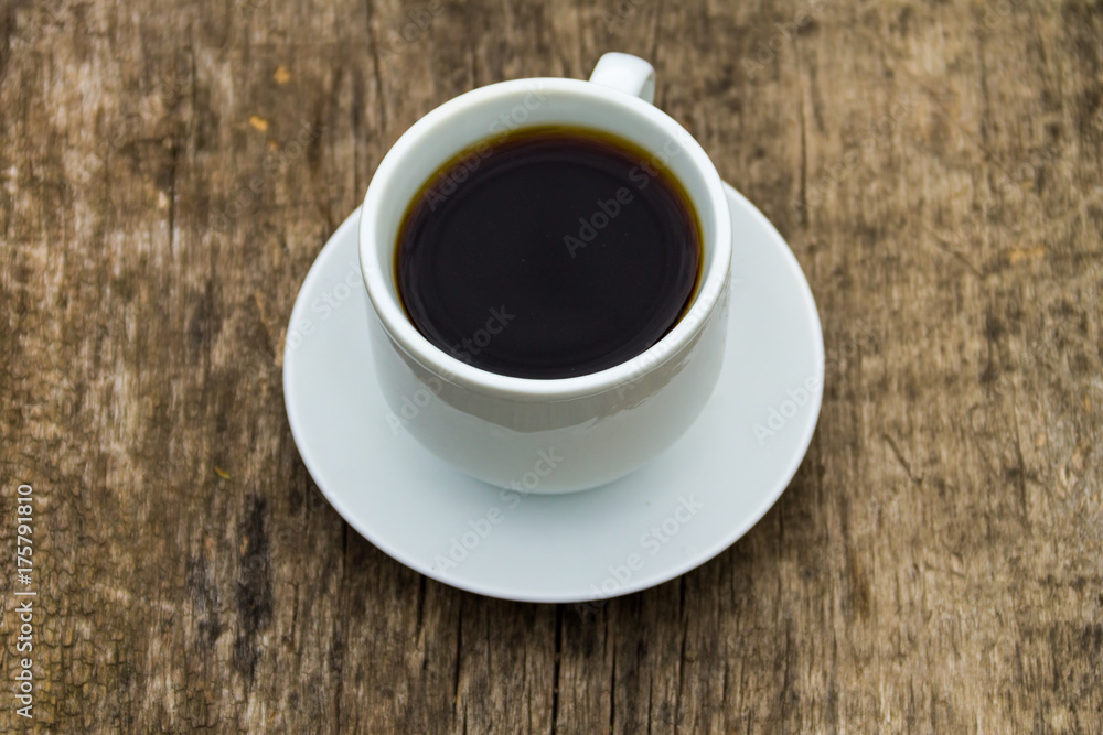 Cup of coffee on wooden table