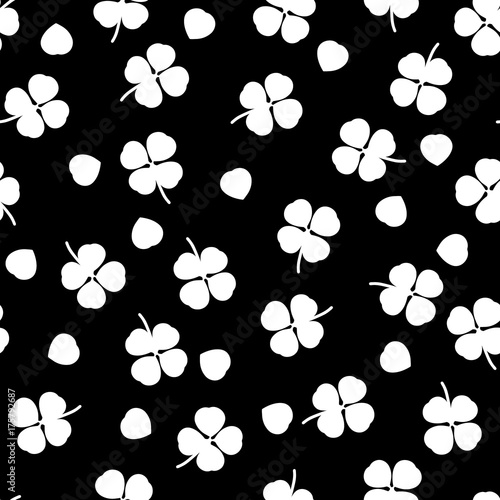 Seamless black pattern with white clover leaves  - Eps10 vector graphics and illustration