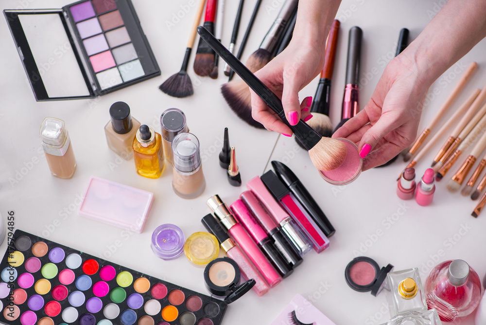 Collection of make up products displayed on the table Collection of make up products displayed on the table