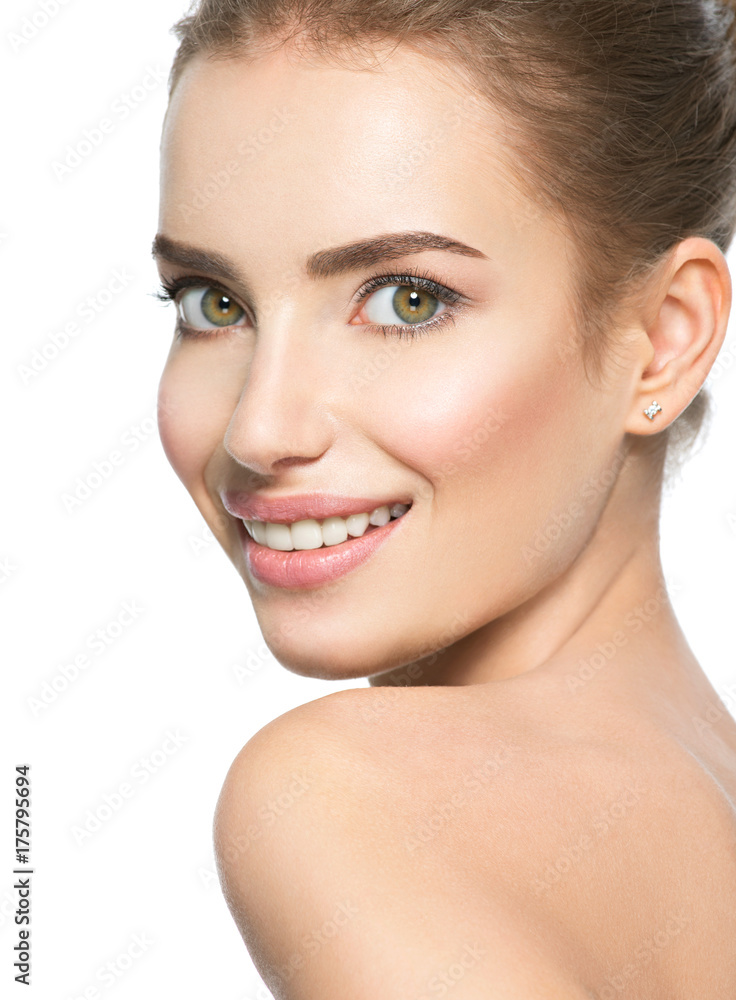 Fototapeta premium Beautiful face of smiling woman with clean fresh skin