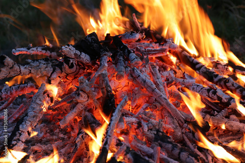 hot heat of a large bonfire with burnt branches