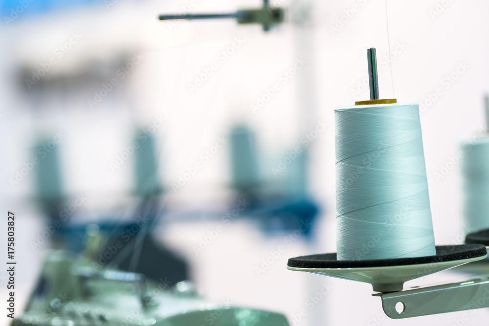 Spool of white threads on sewing machine, closeup Stock Photo | Adobe Stock
