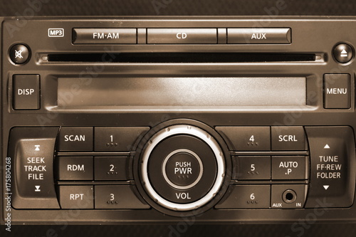 Car audio system intentionally focus at main power button. © eurostar1977