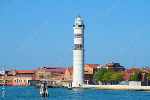 Lighthouse on the Murano island on a sunny day. Venice, Italy