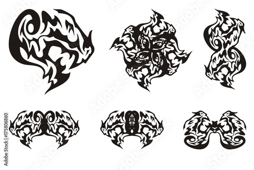 Dragon head symbols in tribal style. Terrible dragon head with an open jaw and double dragon symbols formed from it for your design