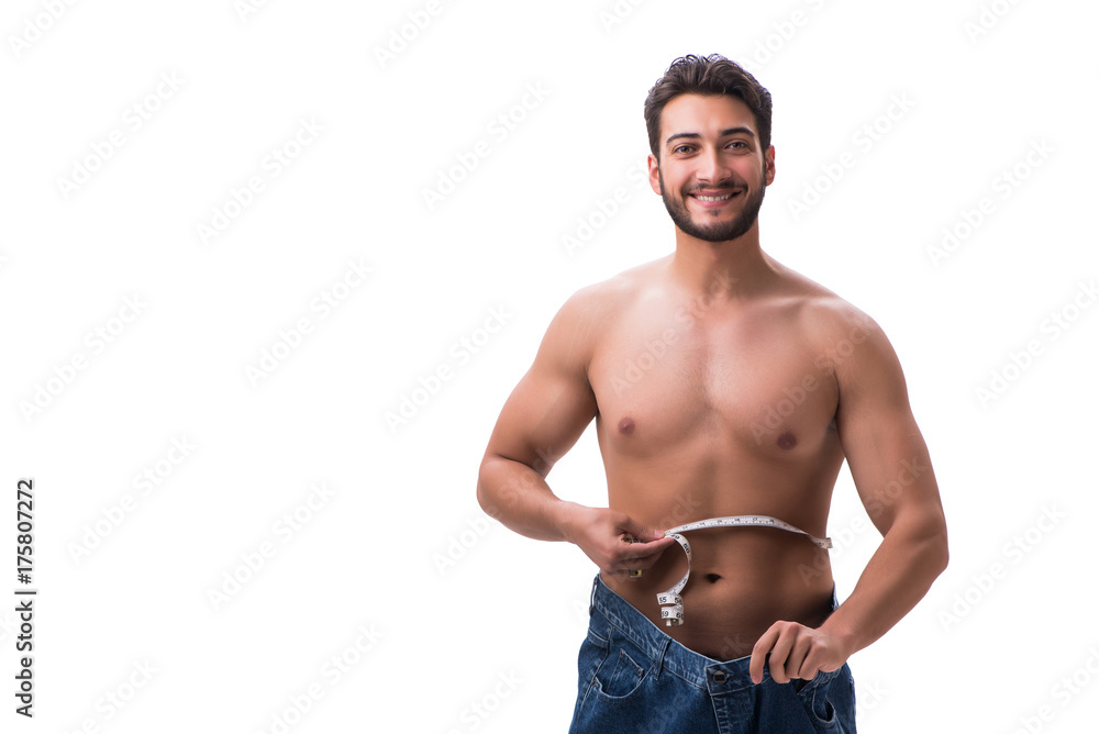Fototapeta premium Man in dieting concept with oversized jeans