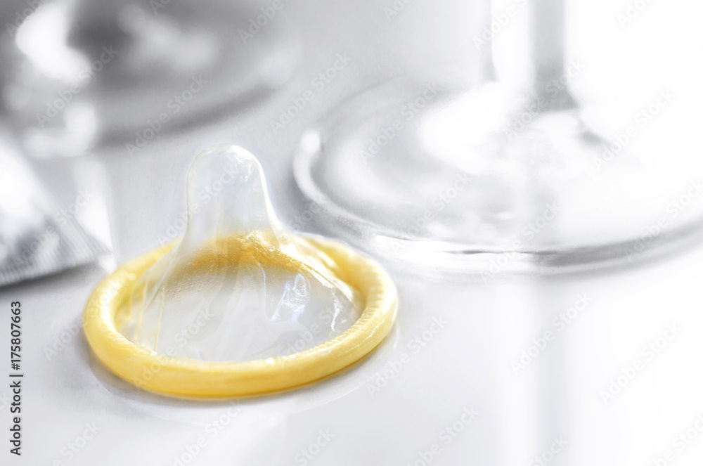 condom with a glasses on white background. condom with a glasses on white background.
