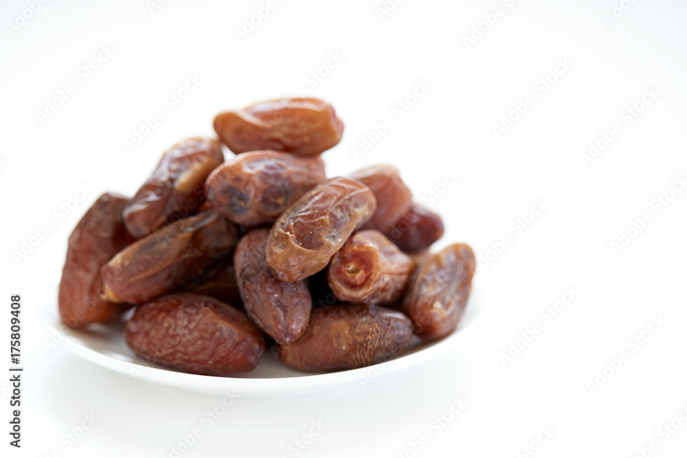 Dried Dates Fruits on dish white background