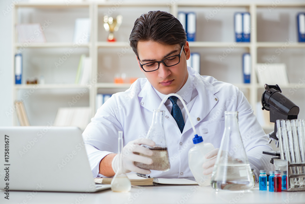 Young researcher scientist doing a water test contamination expe Young researcher scientist doing a water test contamination expe
