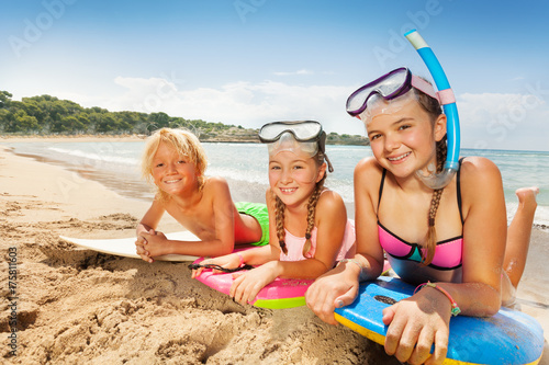 Cute kids enjoying sun on sandy beach © Sergey Novikov