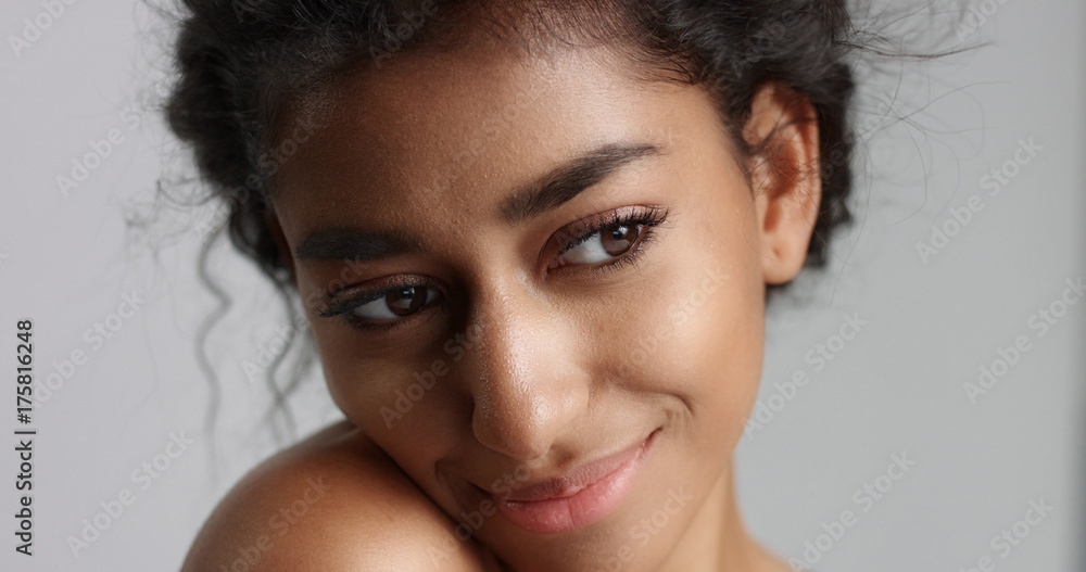 happy serene young woman with beautiful olive skin and curly hair ideal skin and brown eyes happy serene young woman with beautiful olive skin and curly hair ideal skin and brown eyes