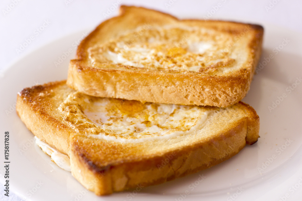 Toasted bread fried with egg inside. Isolated
