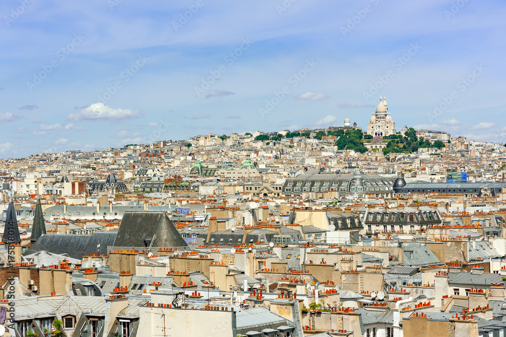 Paris roofs with Montmartre and the Sacre-Coeur in the background, France