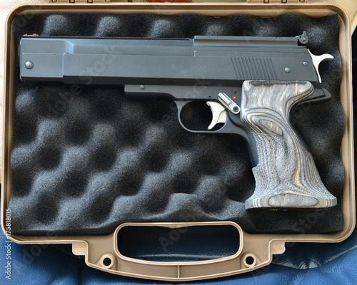 Photography An automatic pistol in a Pistol case.