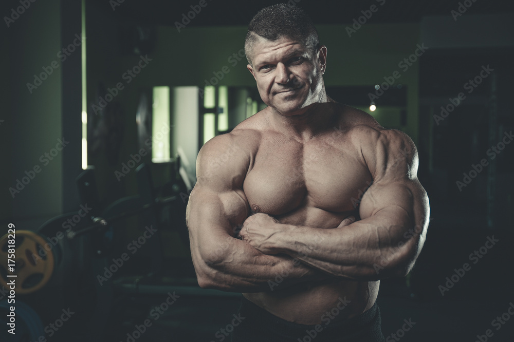 Brutal Caucasian bodybuilder working out in gym Brutal Caucasian bodybuilder working out in gym