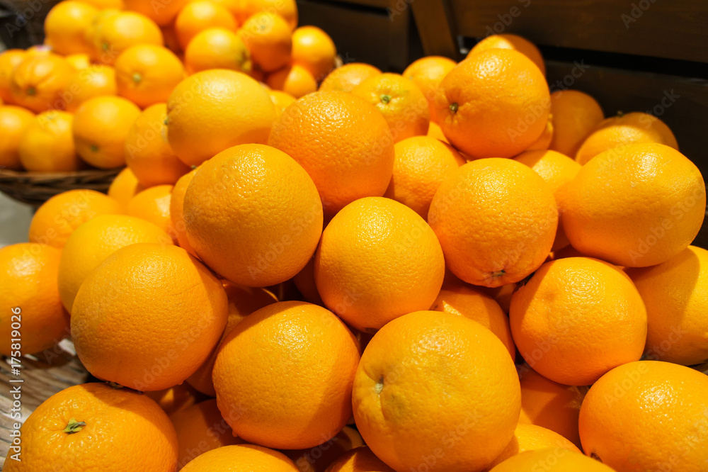 Stack of many fresh mandarin oranges in the market. For food, fruit, kitchen, texture, background and vegetables. Stack of many fresh mandarin oranges in the market. For food, fruit, kitchen, texture, background and vegetables.