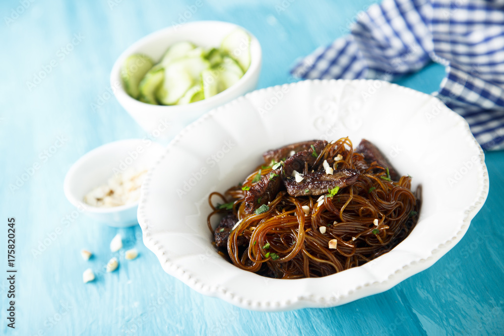 Rice noodles with soy sauce, peanuts and cucumber salad Rice noodles with soy sauce, peanuts and cucumber salad