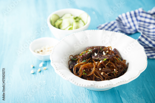 Rice noodles with soy sauce, peanuts and cucumber salad