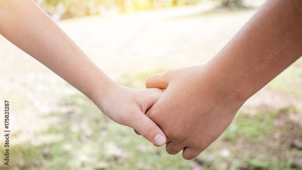 Asian little girls holding hands couple together show Relationship between sister and familay at gardren outdoor, Love parents friendship concept. Asian little girls holding hands couple together show Relationship between sister and familay at gardren outdoor, Love parents friendship concept.