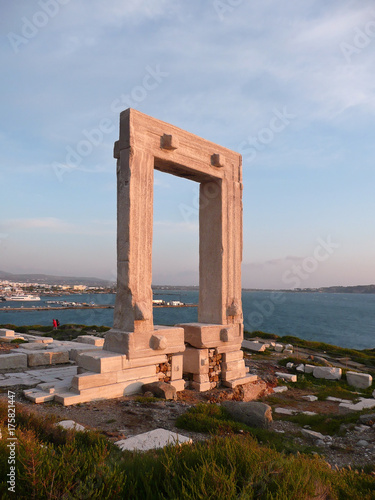 The ancient stone gate (Portara or the Temple of Apollo) on the Naxos Island, Greece 