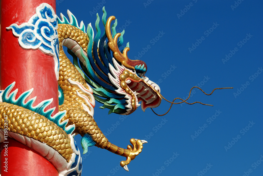 Fototapeta premium Chinese dragon in front of blue sky.