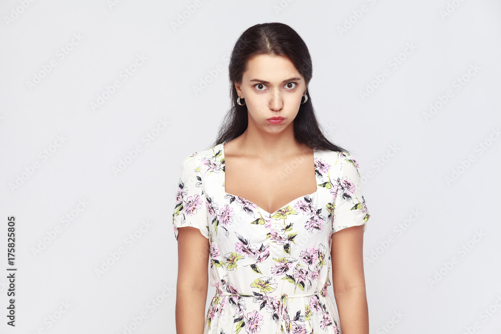 Cute brown haired woman puffed cheeks and have a funny face. Cute brown haired woman puffed cheeks and have a funny face.