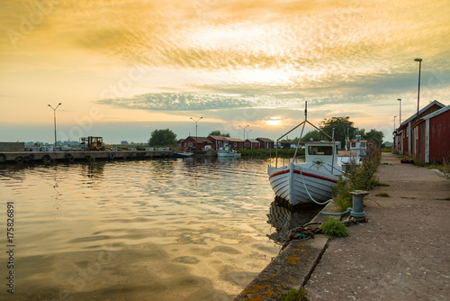 The small fishing harbor Gräsgård harbor on the island of Öland in the evening light photo