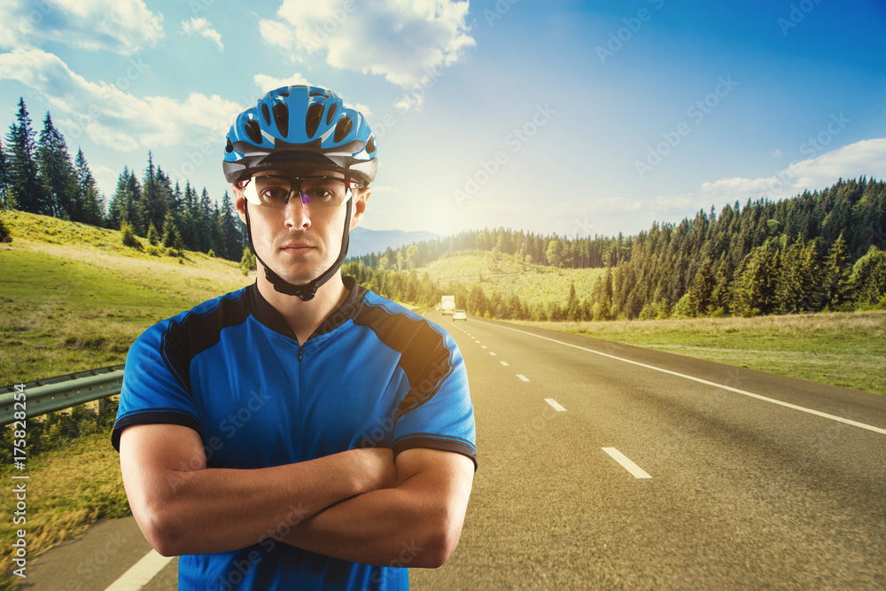 cyclist portrait on a background of a picturesque mountain landscape cyclist portrait on a background of a picturesque mountain landscape