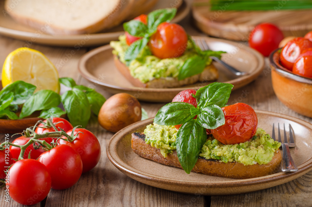 Avocado spread bread with baked tomato Avocado spread bread with baked tomato