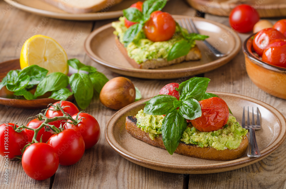 Avocado spread bread with baked tomato Avocado spread bread with baked tomato