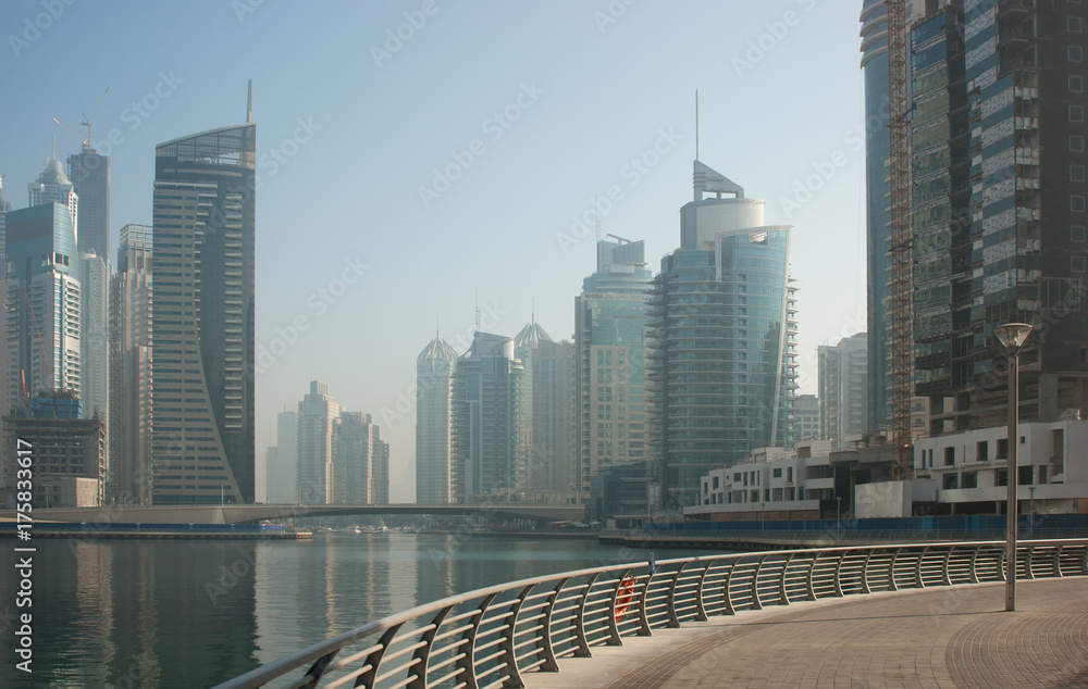 Naklejka premium Modern city on the bay in the morning mist