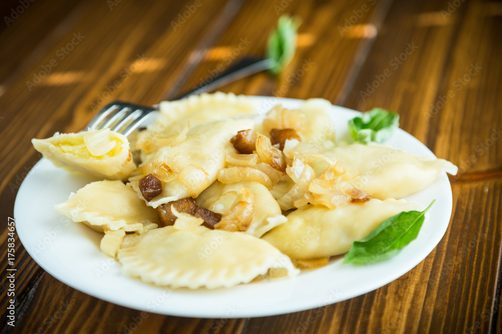 boiled dumplings with potatoes and fried onions boiled dumplings with potatoes and fried onions