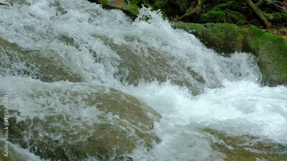 water flowing on rock in mountain creek. natural landscape of stream in waterfall. cascade in forest water flowing on rock in mountain creek. natural landscape of stream in waterfall. cascade in forest