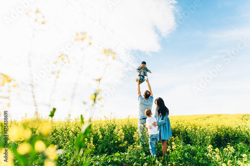 Family Dad Mom and Children in the Field