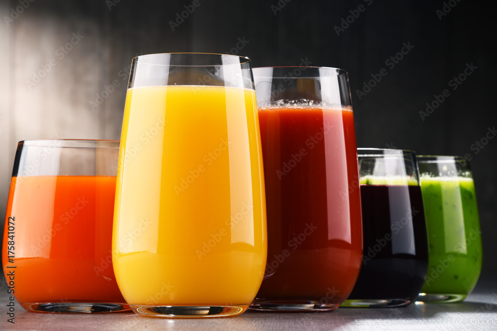Glasses with fresh organic vegetable and fruit juices Glasses with fresh organic vegetable and fruit juices