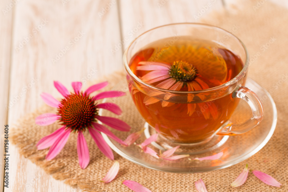 Cup of echinacea tea on white wooden table Cup of echinacea tea on white wooden table