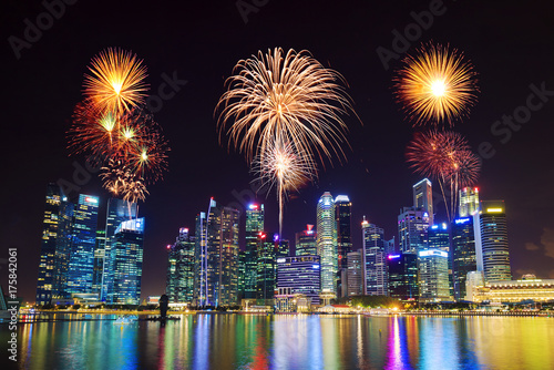 beautiful firework over central business district building of Singapore city at night