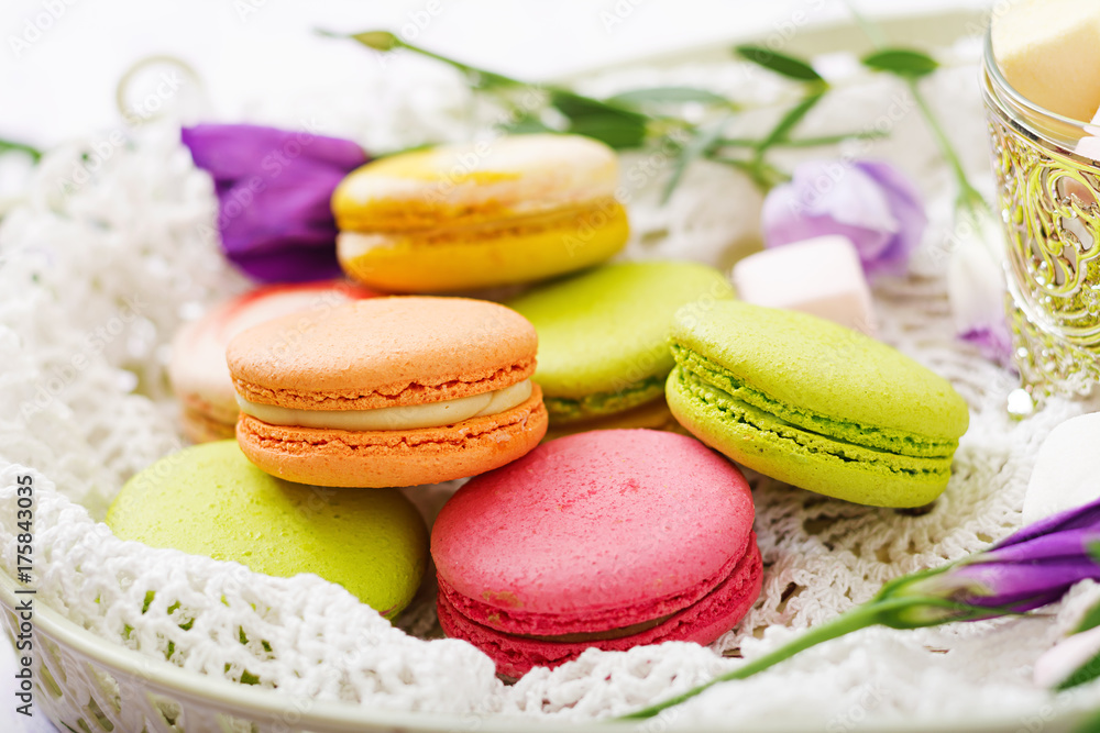 Colorful macaroons and marshmallows on a ligth background. Colorful macaroons and marshmallows on a ligth background.