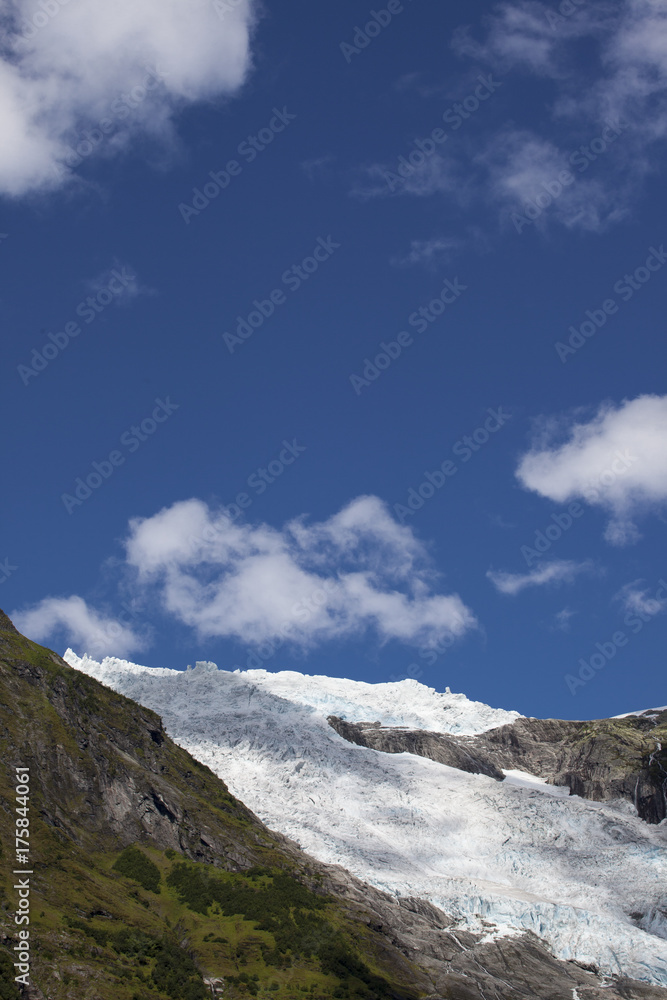 glacier with clouds and blue sky